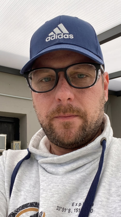 Adapt Dew customer wearing glasses outdoors, real customer photo