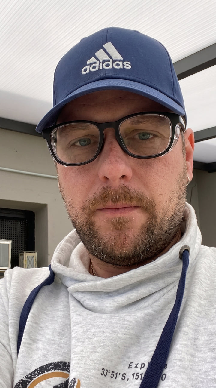 Adapt Dew customer wearing glasses outdoors, real customer photo