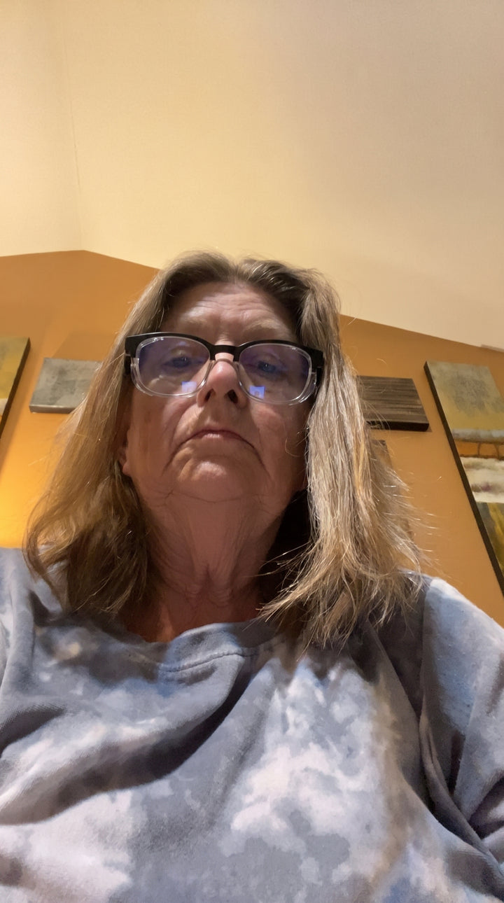 Adapt Dew customer wearing glasses indoors, real customer photo