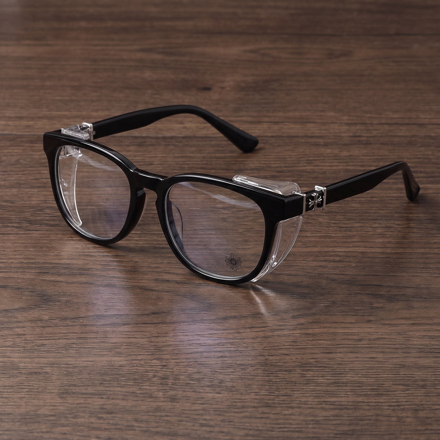 Adapt Dew glasses in black resting on a wood table